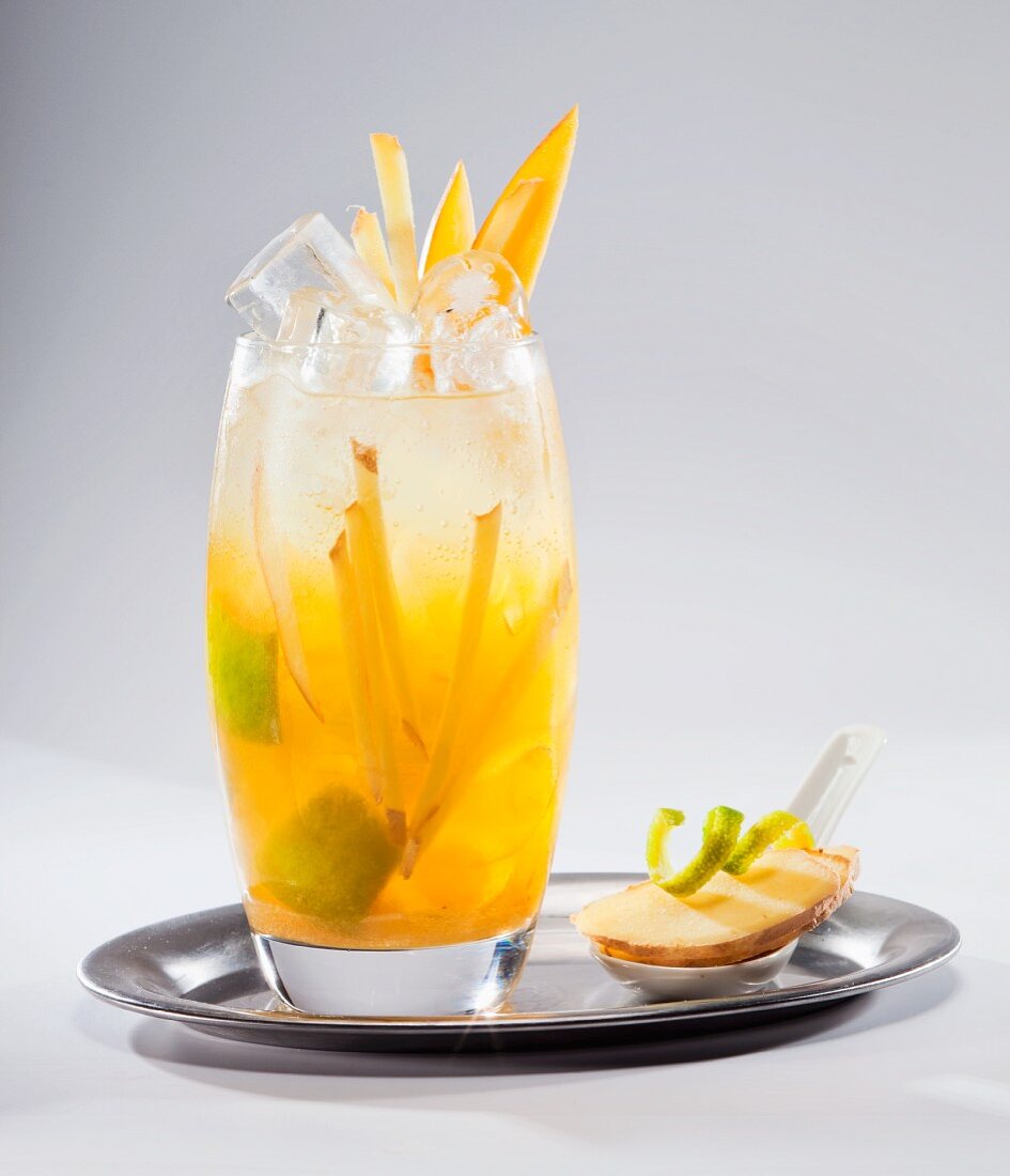 Fruit cocktail with ginger juice on a silver tray