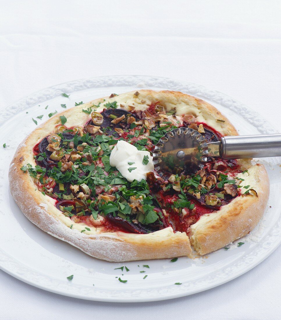 Pizza with beetroot, walnuts and parsley
