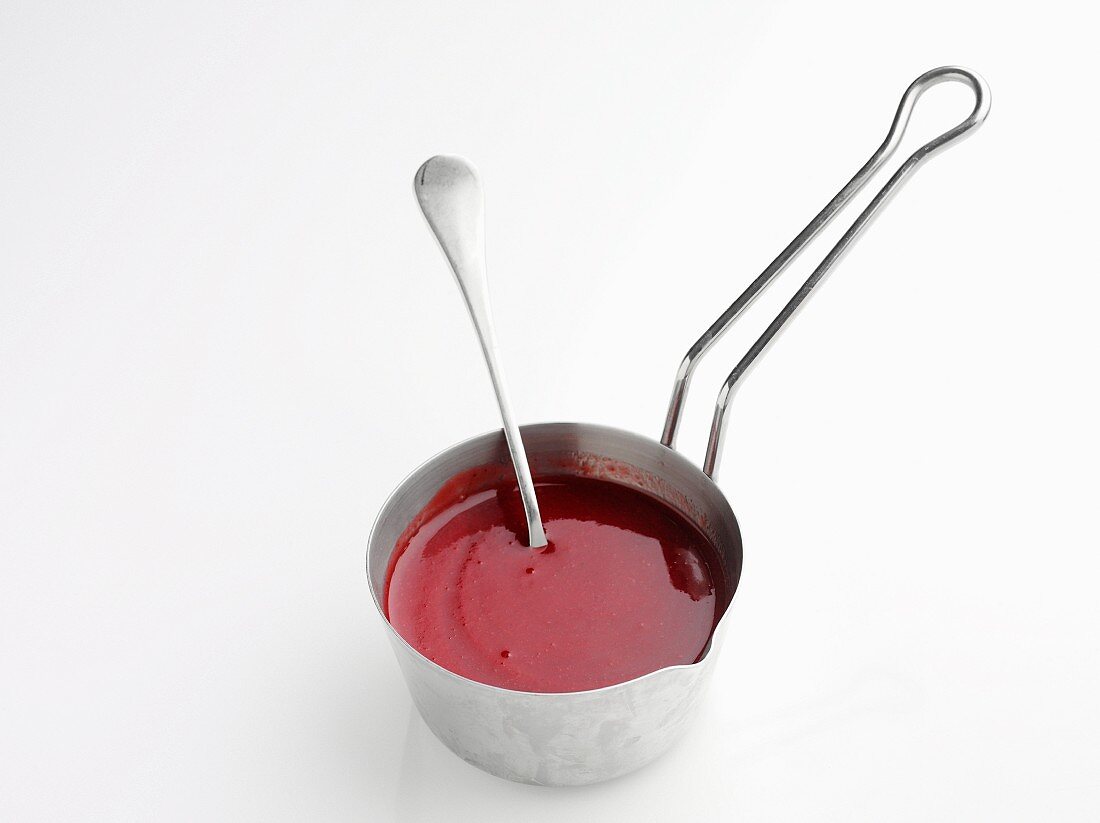 Strawberry sauce in a saucepan