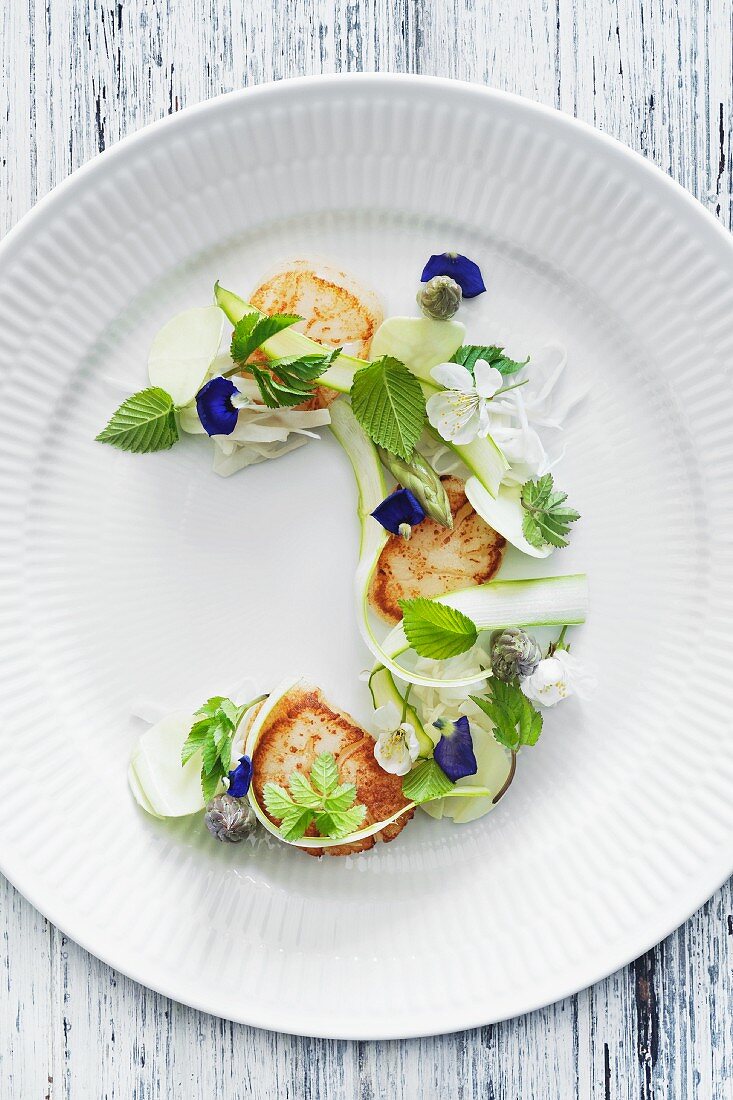 Fried scallops, green asparagus, summer cabbage and beech leaves.