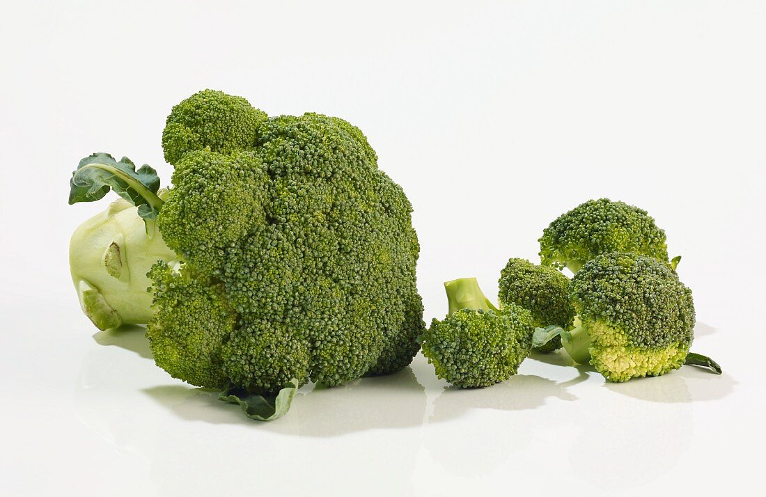 A whole broccoli and florets
