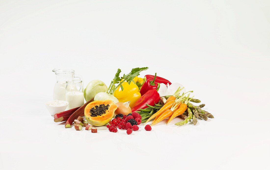 A still life featuring fruit, vegetables and dairy products