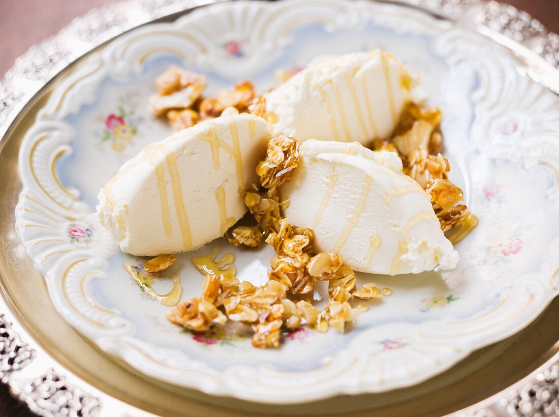 Quenelles of yoghurt with almonds, oats and caramel sauce