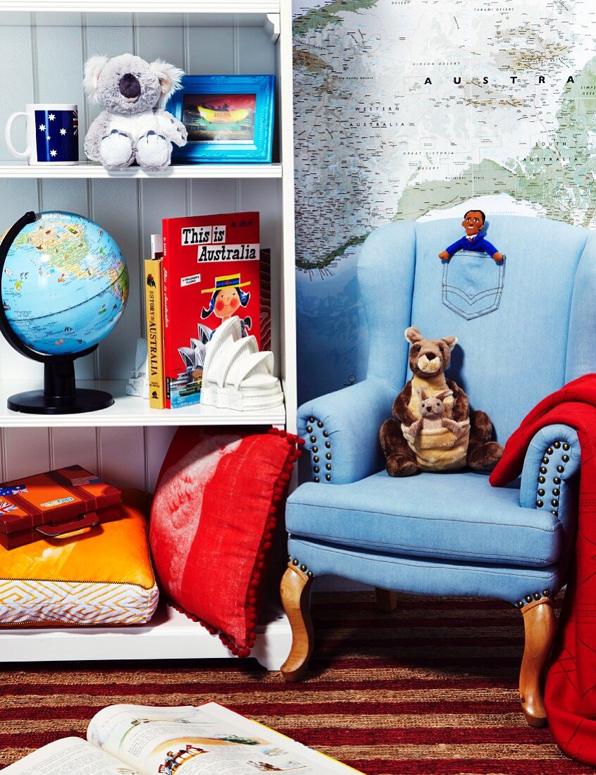 Child's room decorated with an armchair, shelves and Australian themed decorations