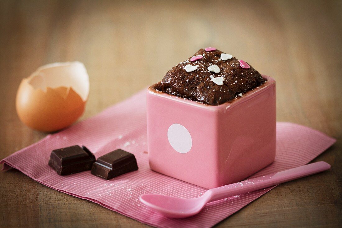 Mini chocolate cake with sugar hearts, and ingredients
