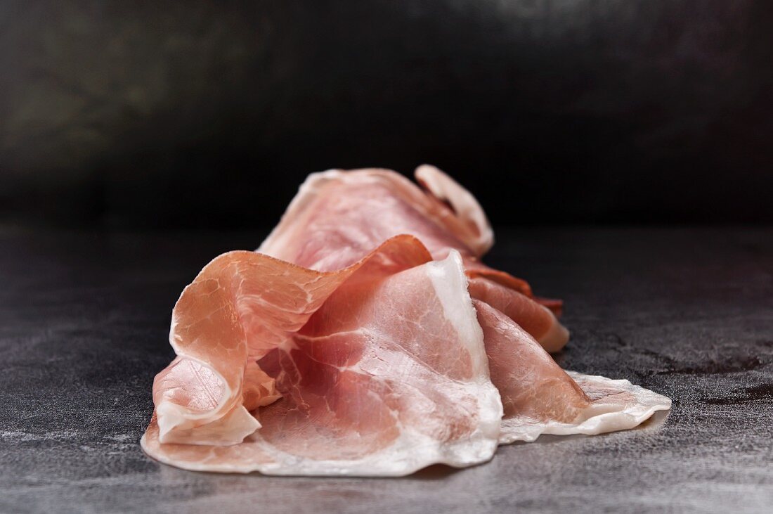Several slices of dry-cured ham