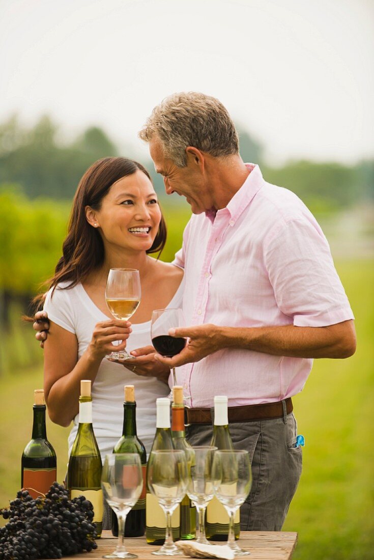 Couple tasting wine together outdoors