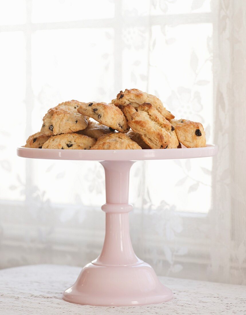 Scones with raisins on a cake stand