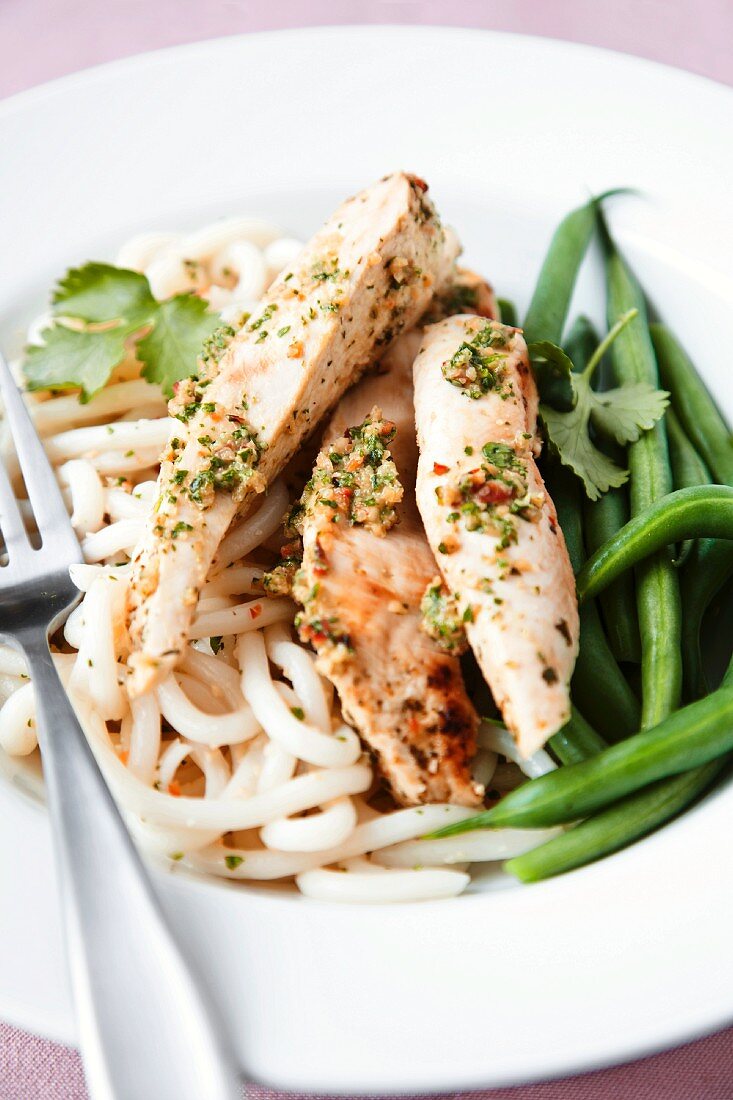 Chicken, noodles and rice on plate