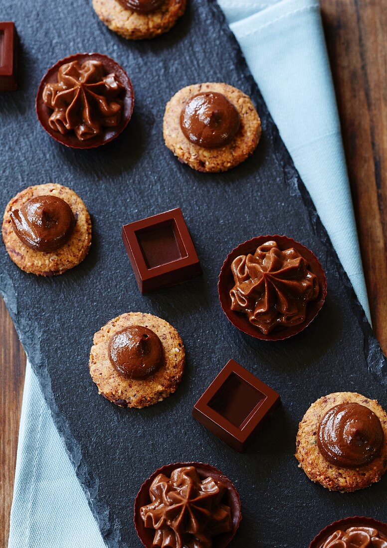 Biscuits with chocolate cream, mini chocolate tarts, and chocolate squares