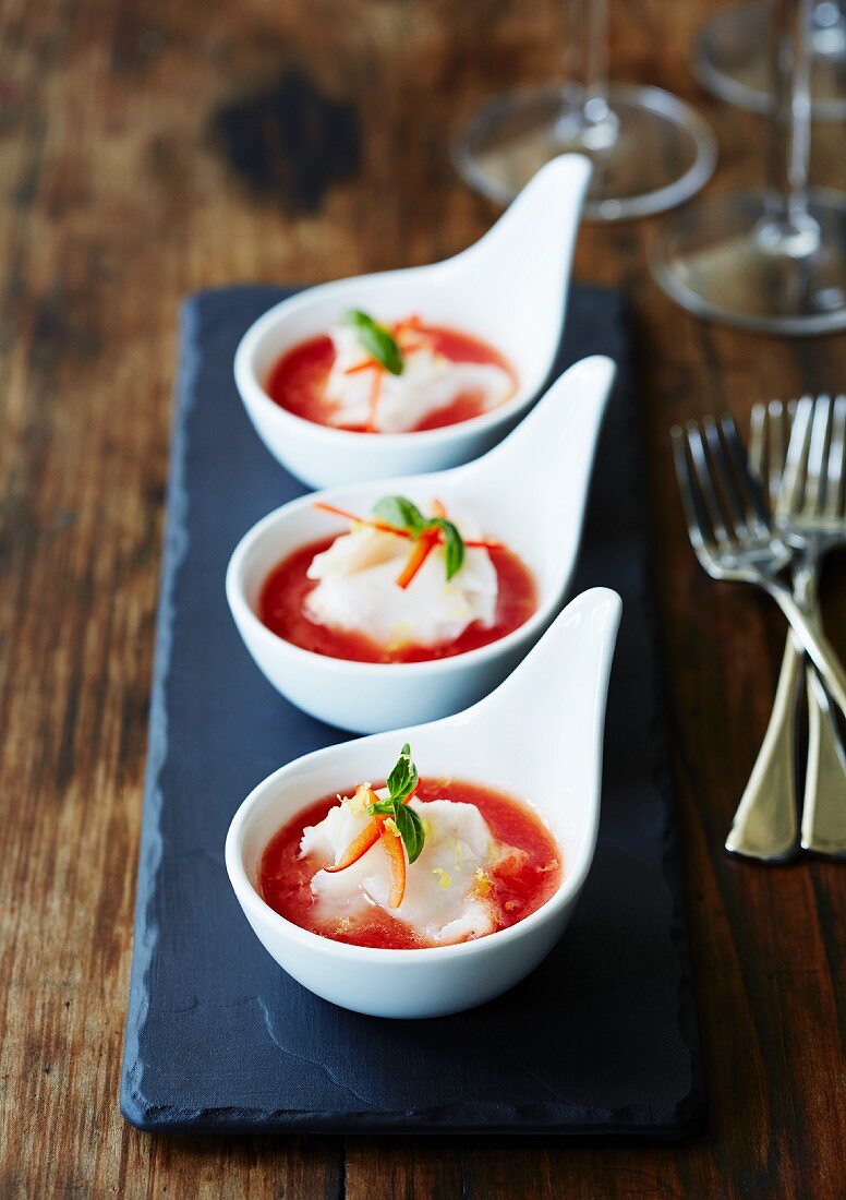 King mackerel ceviche with tomatoes in tasting spoons