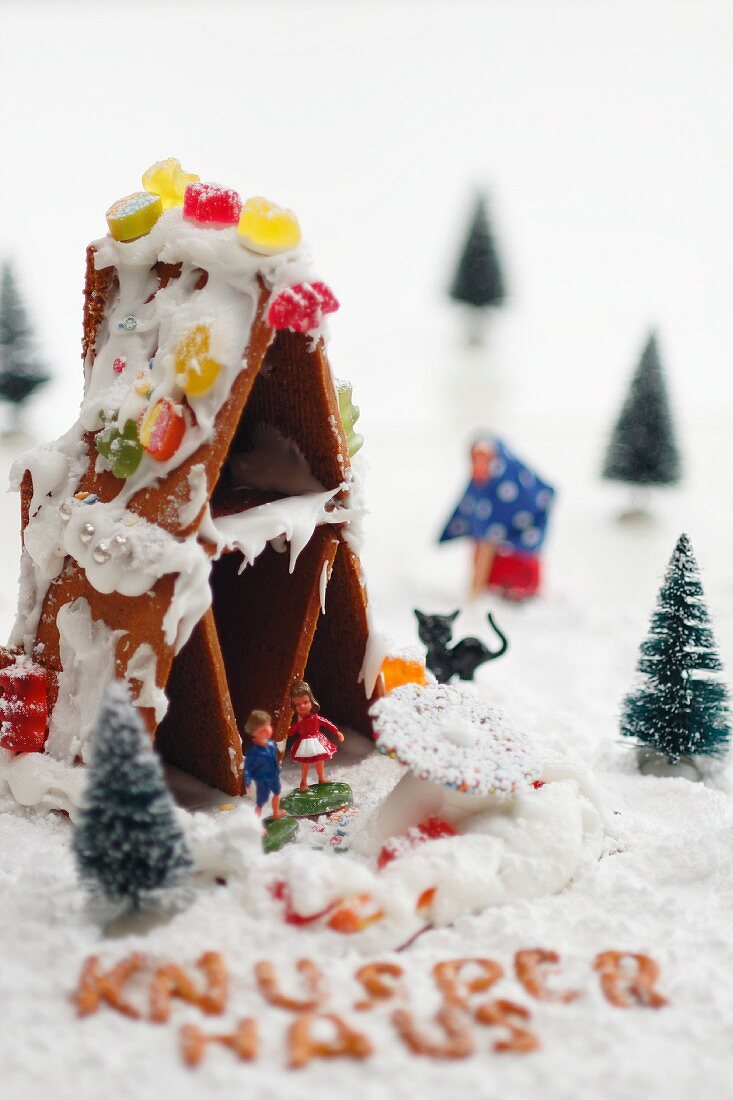 A gingerbread house with fairy-tale figures