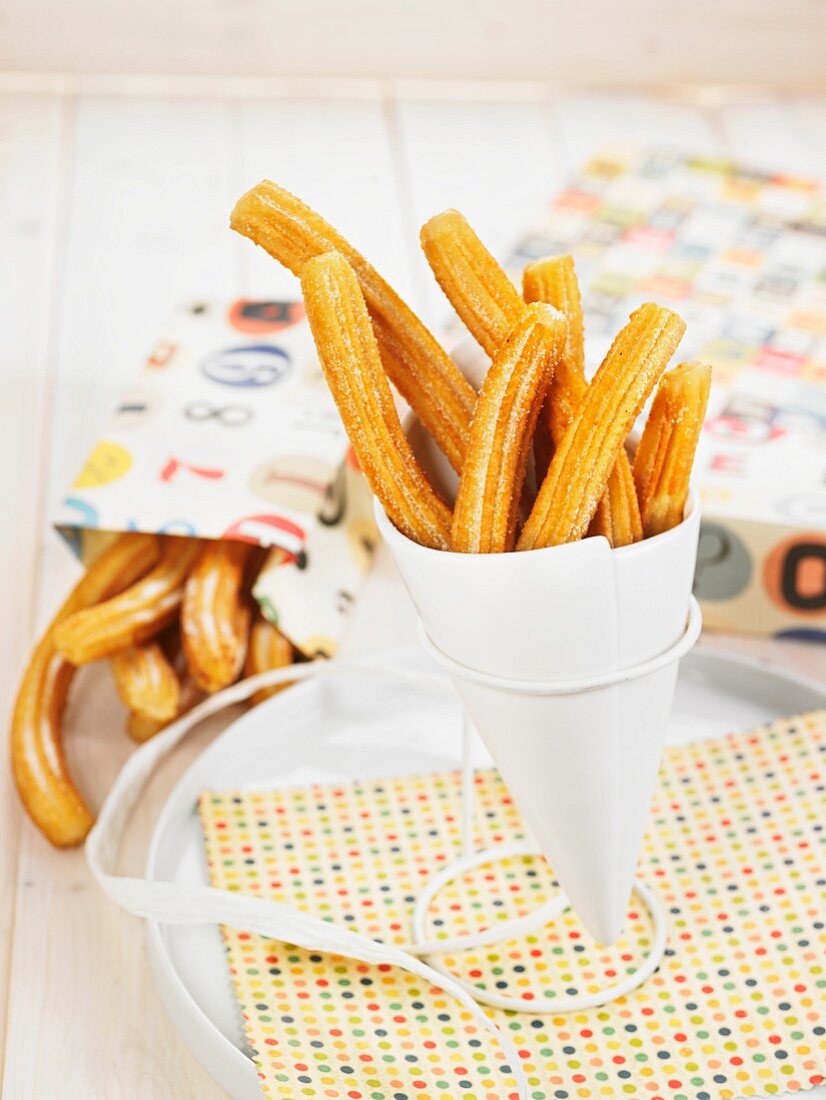 Churros in a paper cone to take away
