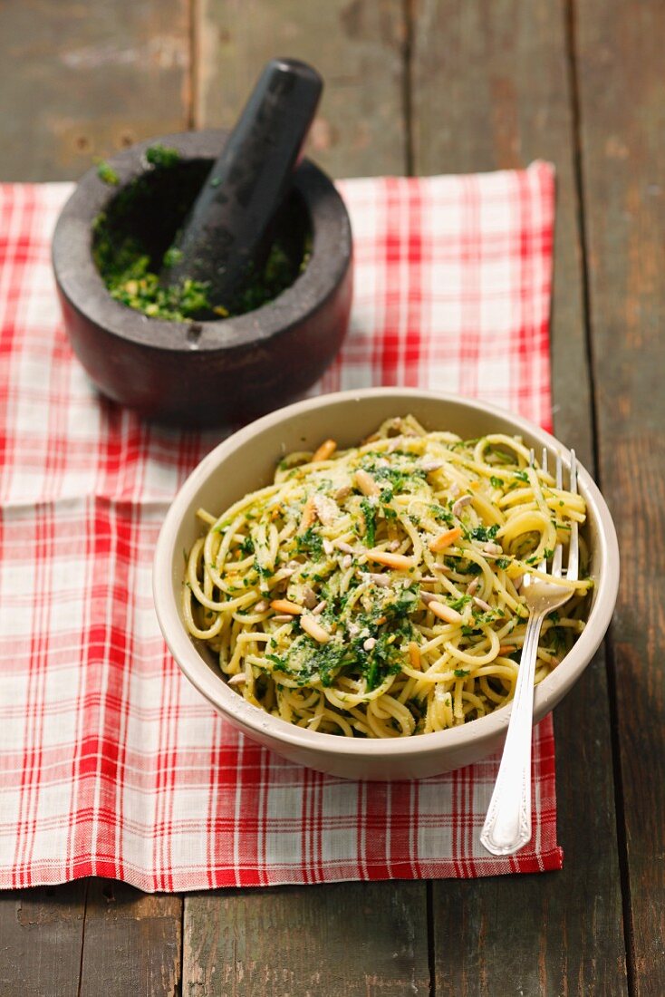 Spaghetti with parsley pesto and pine nuts