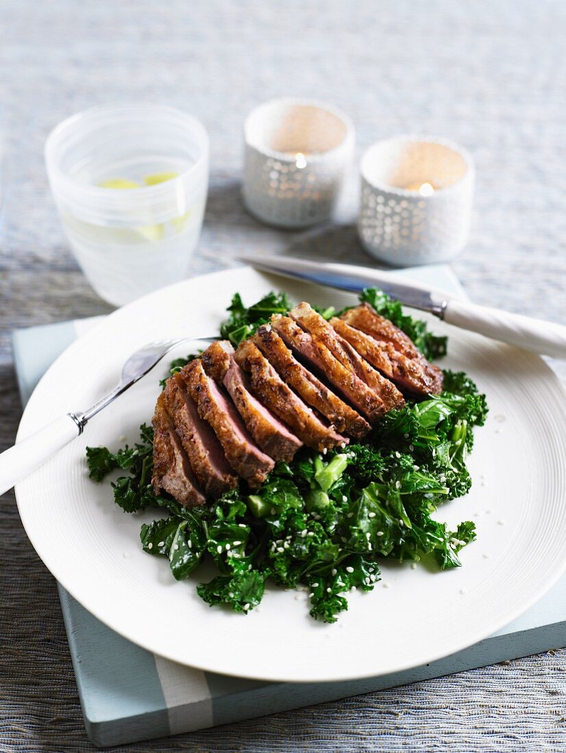 Duck breast with ginger, kale and sesame seeds