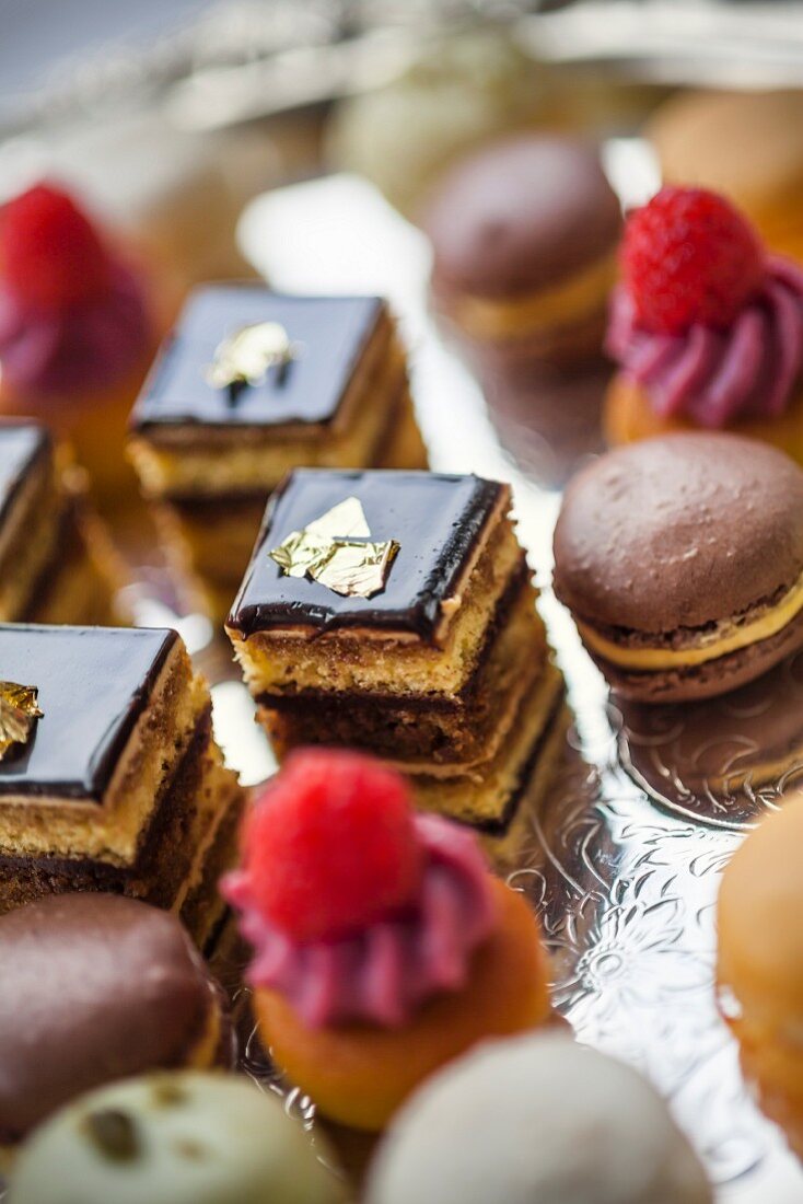 Petit fours on an elegant, silver cake stand