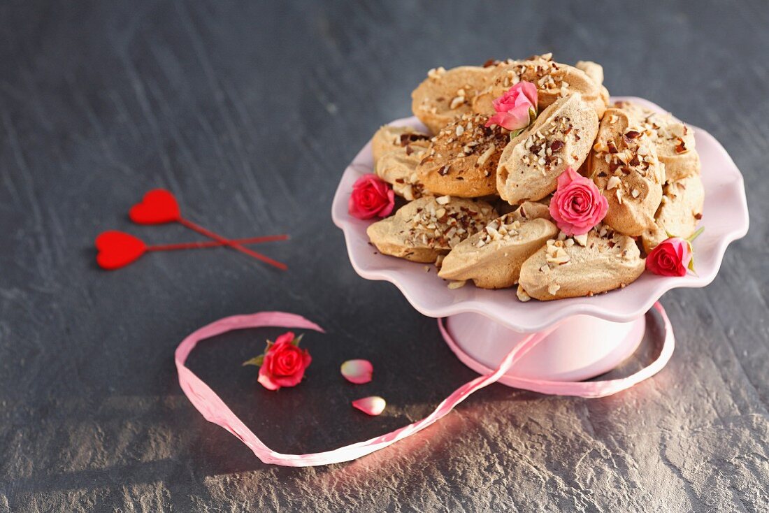 Meringues with cinnamon, nuts and rosebuds
