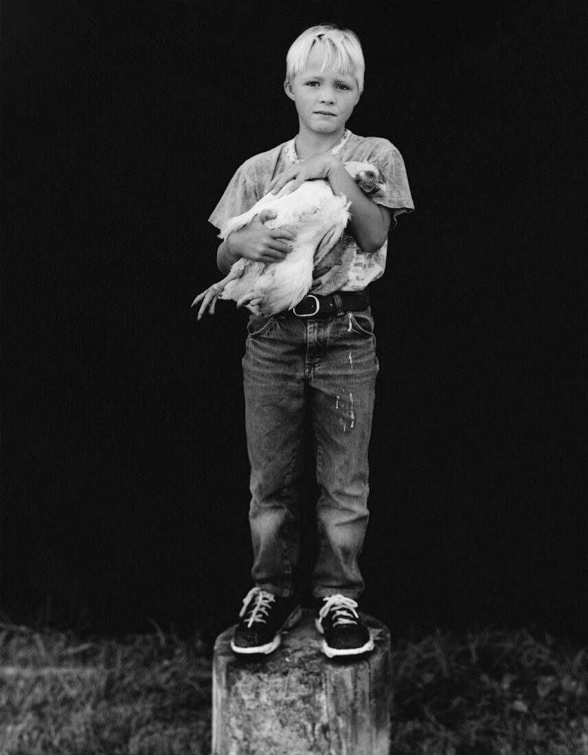 Boy with chicken