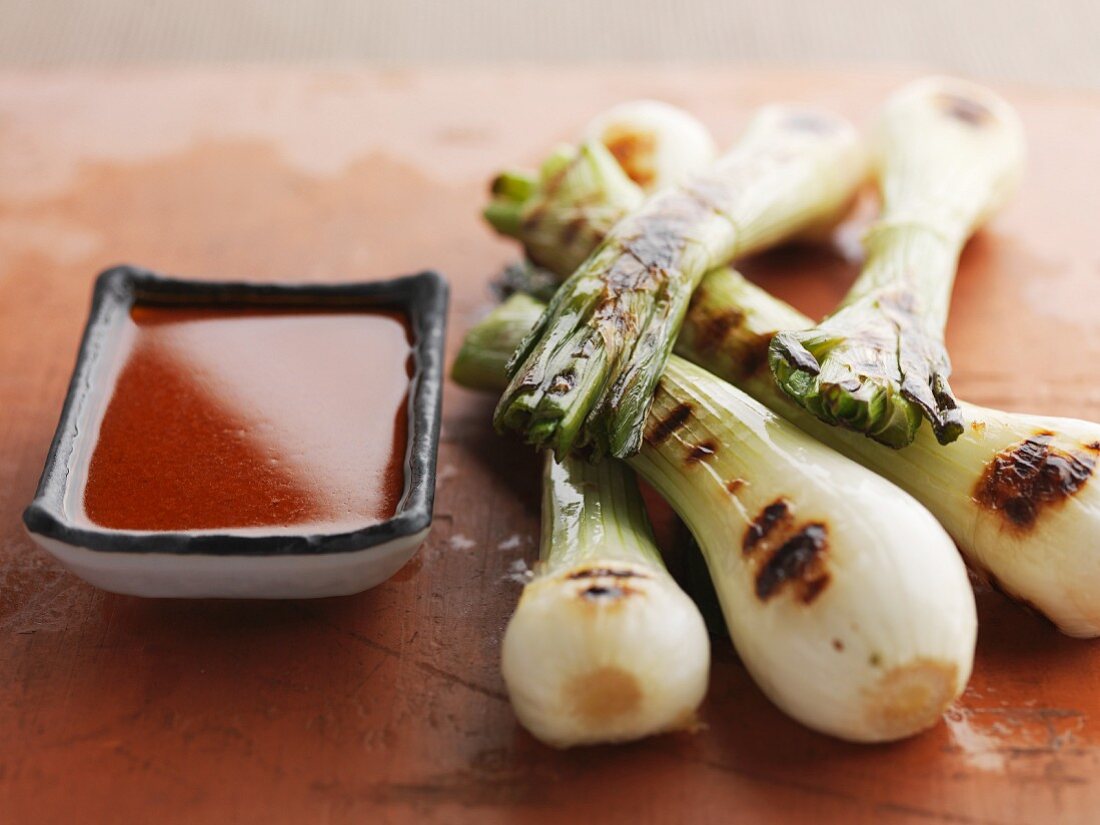 Spring onions with salsa romesco