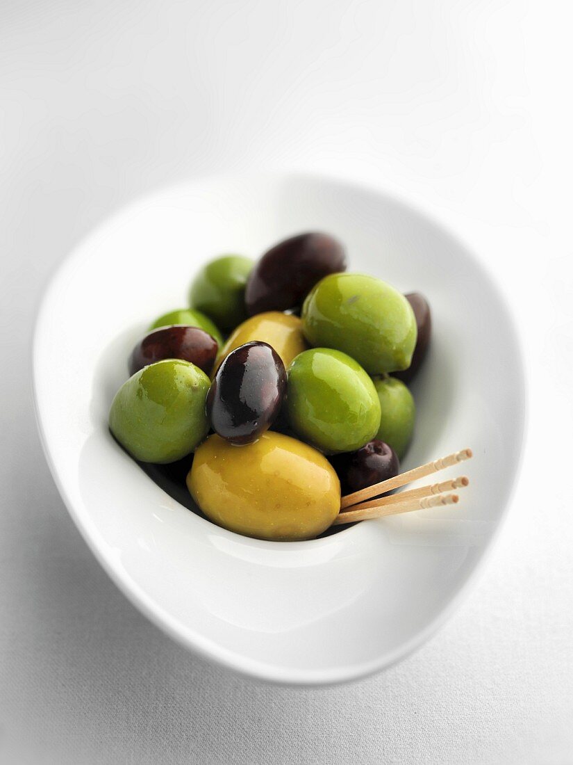 Mixed olives with toothpicks