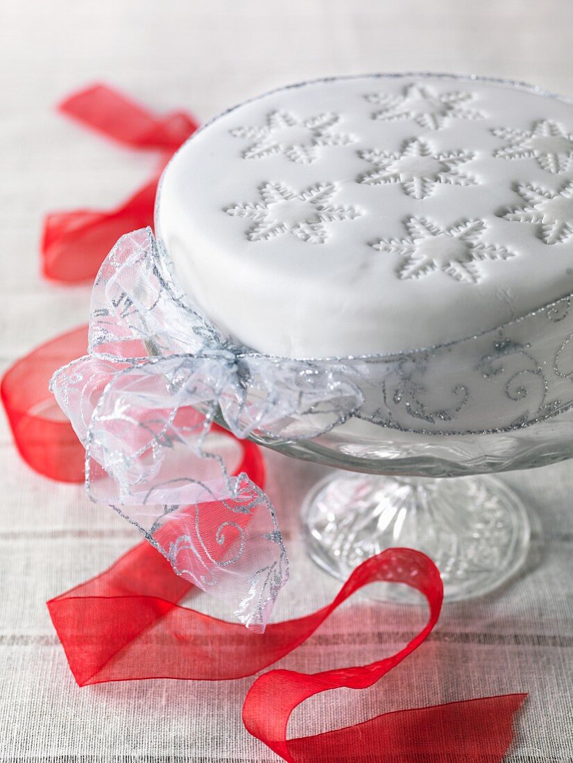 Gluten-free Christmas cake with a red ribbon