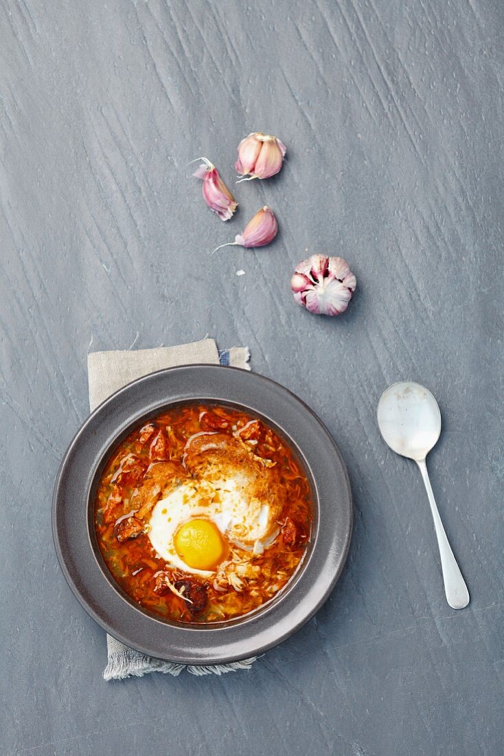 Garlic soup with chorizo and egg