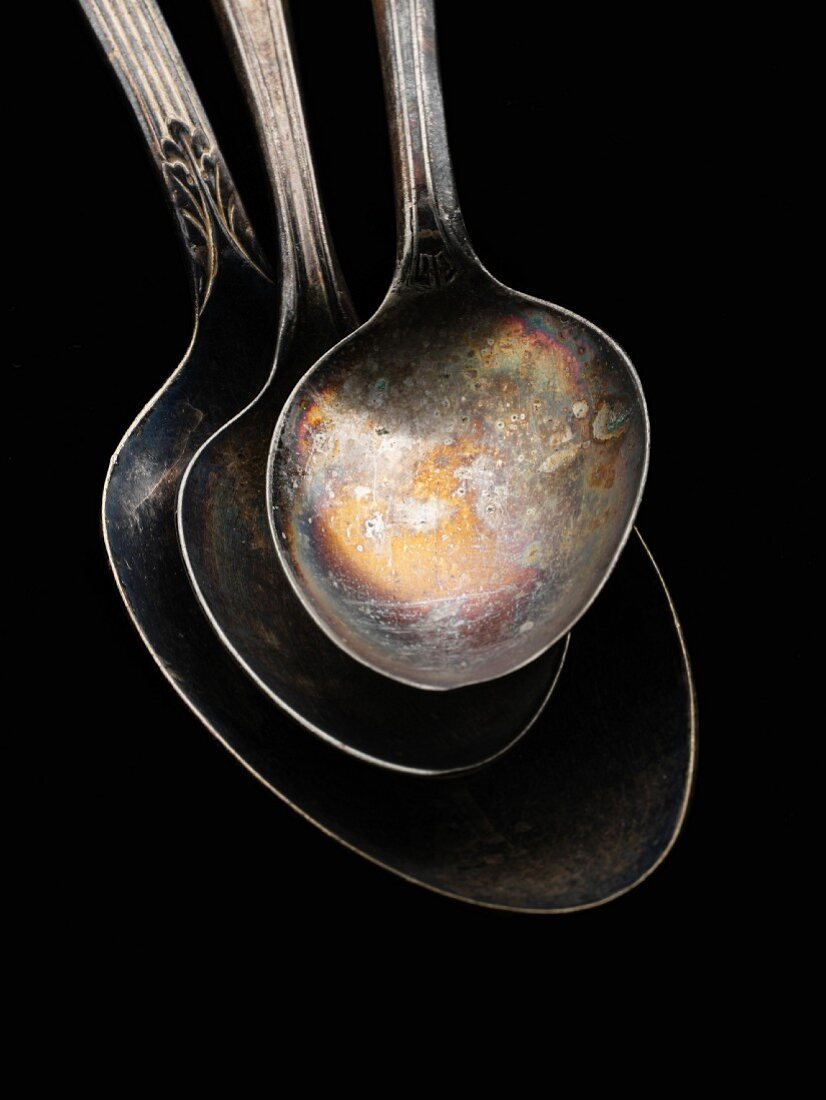 Three Tarnished Silver Spoons