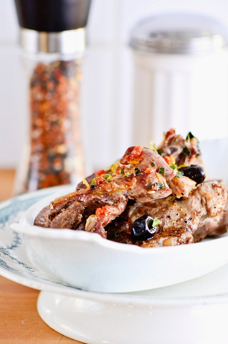 Roasted breast of lamb with olives, chilli and lemon