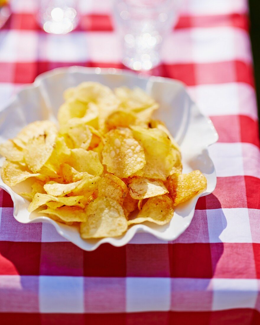 Potato chips in a paper dish