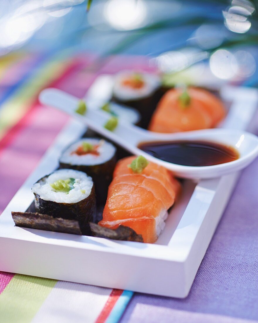 Nigiri and maki sushi with soy sauce