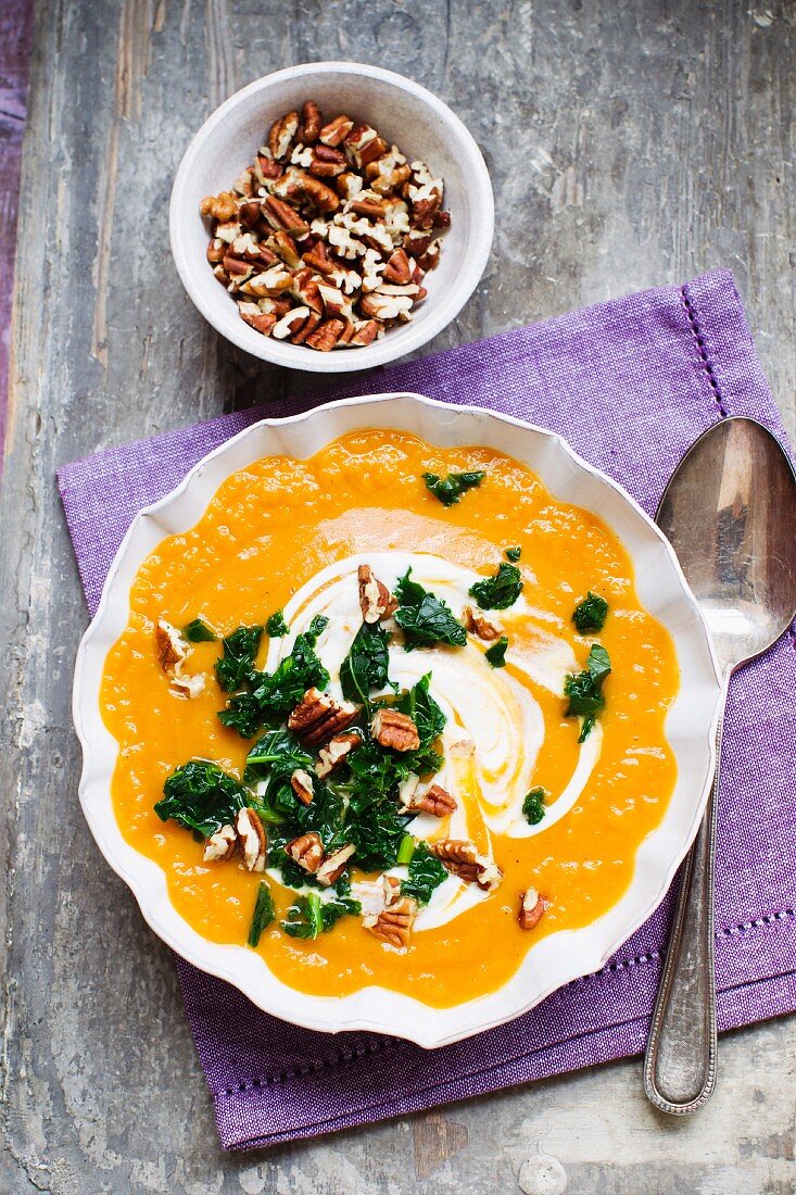 Sweet potato soup with green cabbage and pecan nuts