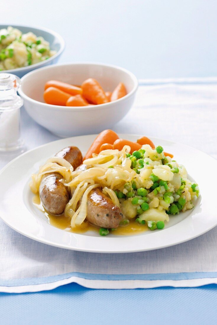 Lamb sausages with mushy peas