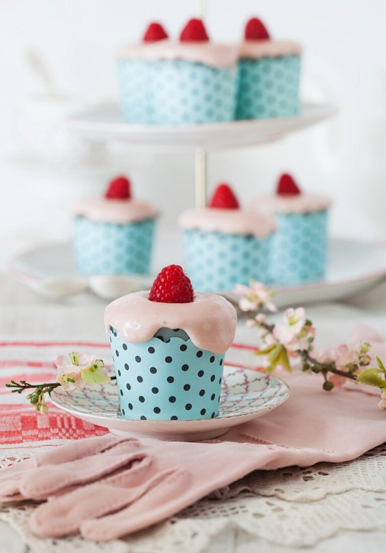 Raspberry cupcakes with cream cheese frosting and vintage gloves