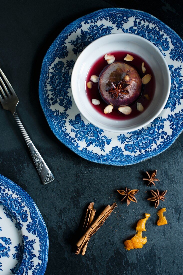 Poached fig in red wine with spices.