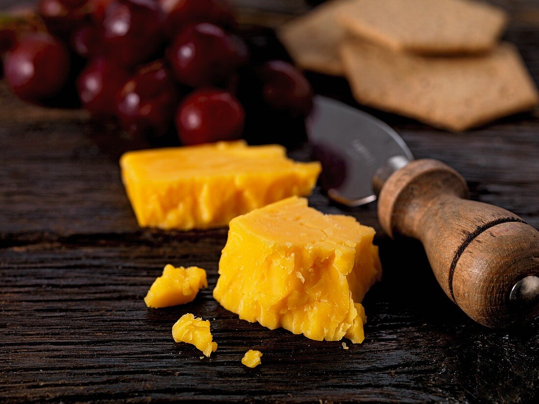 double gloucester cheese with grapes and crackers