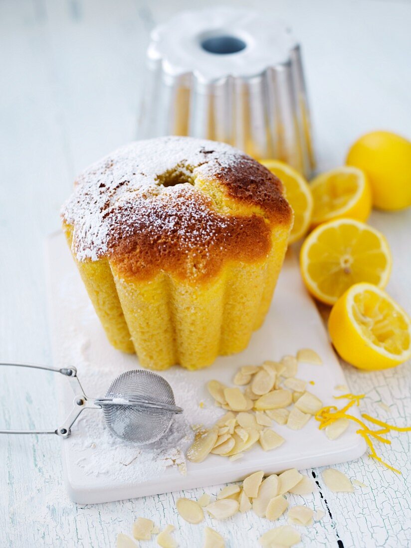 A mini lemon Bundt cake with flaked almonds