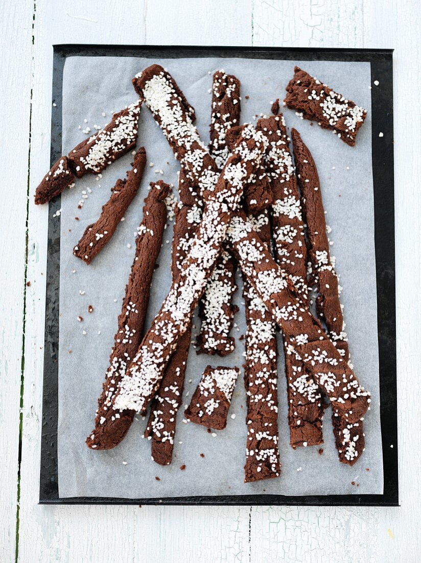 Strips of chocolate cake sprinkled with sugar nibs