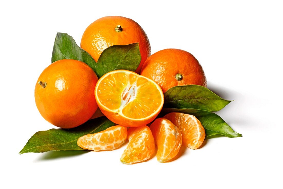 Mandarins (whole, halved and segmented) with leaves