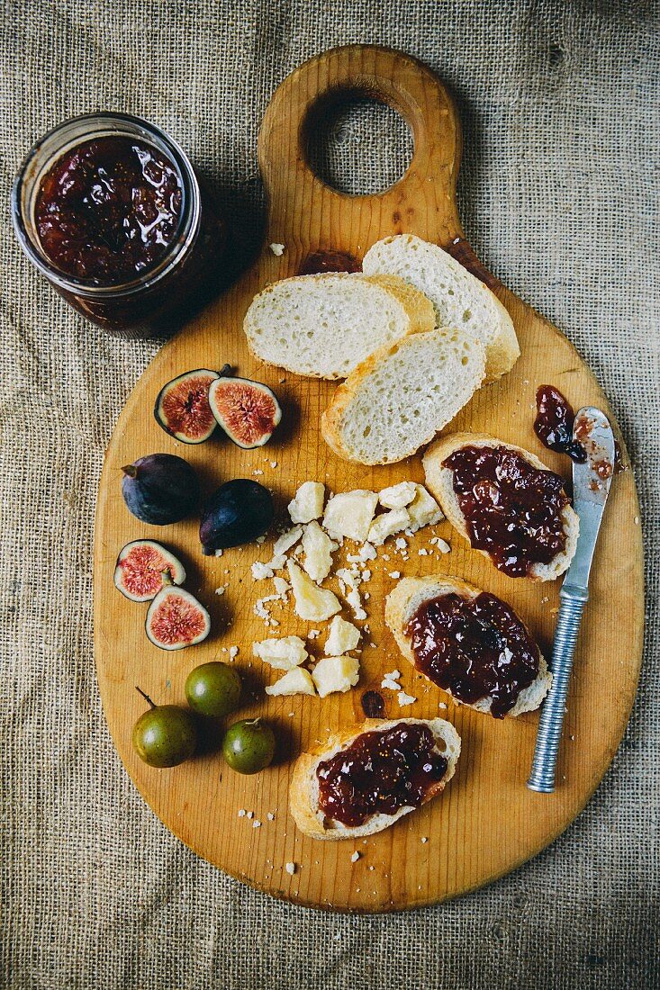 Figs and Bread with Fig Jam on Cutting Board, High Angle View