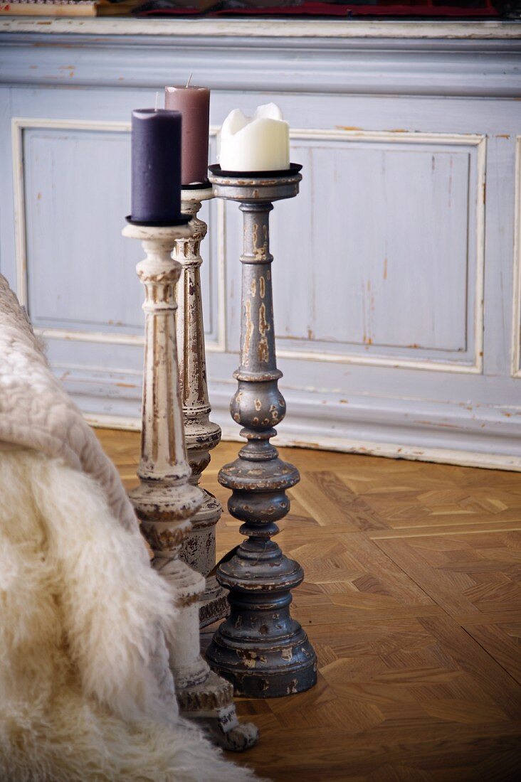 Shabby chic candlesticks on Versailles parquet floor