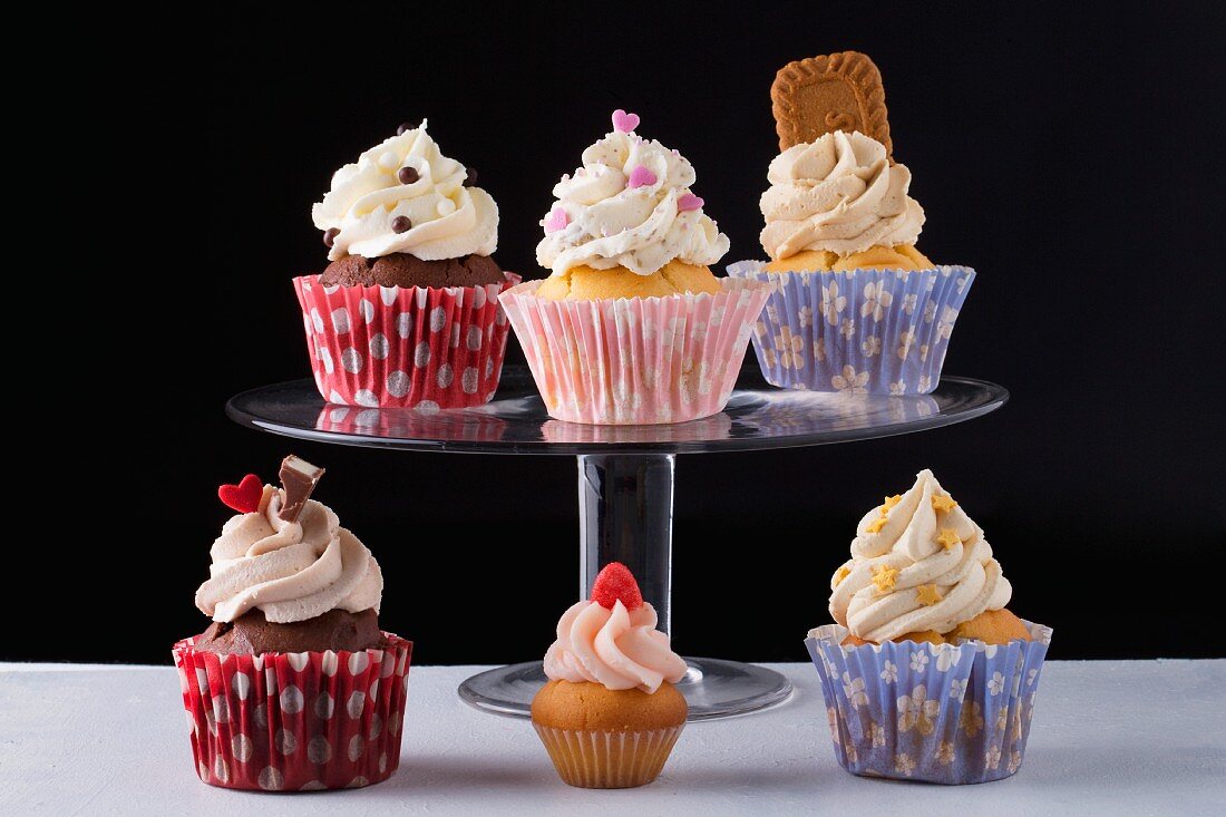Six cupcakes with different decorations