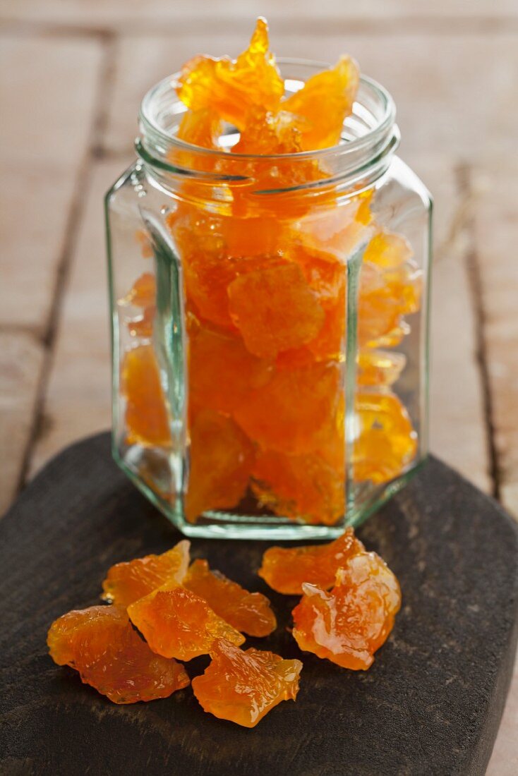 Candied orange pieces in a screw-top jar