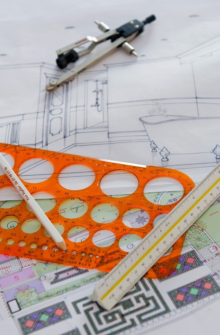 Ruler, stencil & compasses on interior design plans