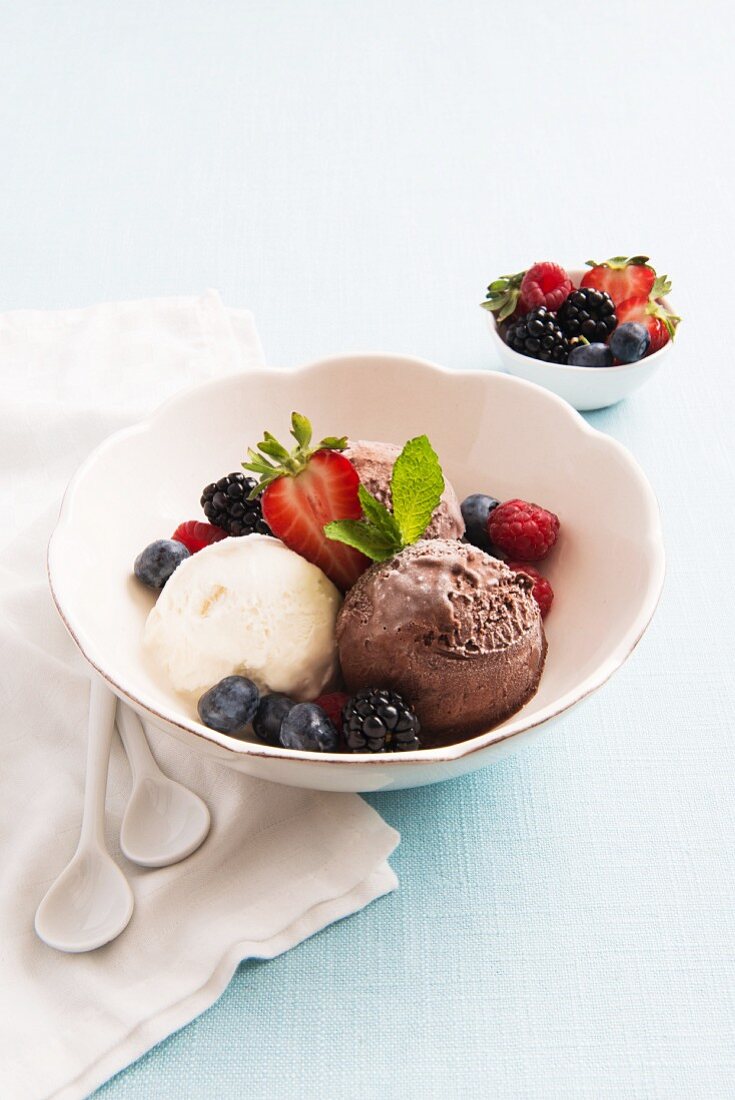 Mixed ice cream with berries and mint