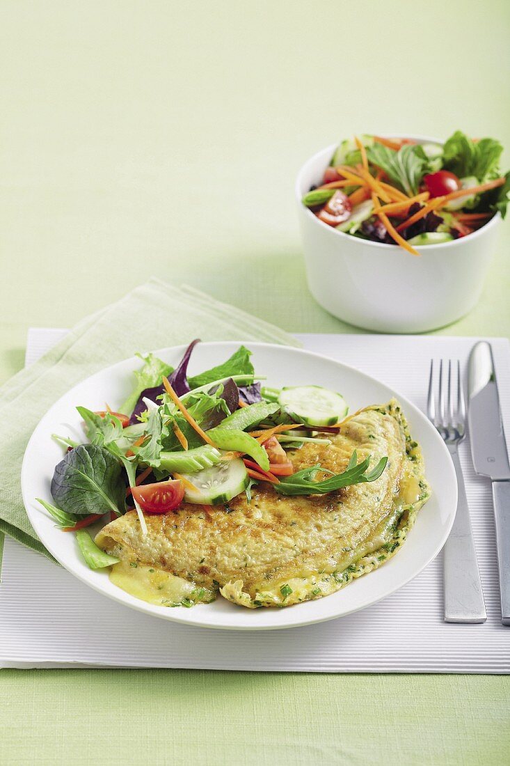 A herb omelette with three sorts of cheese and a side salad