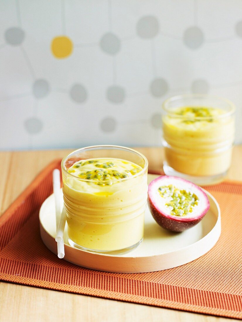 A mango smoothie with a passion fruit