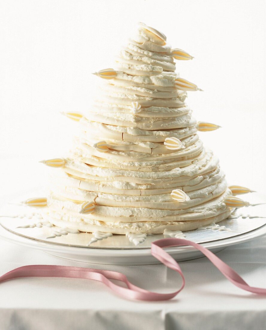 A pyramid cake with white cream