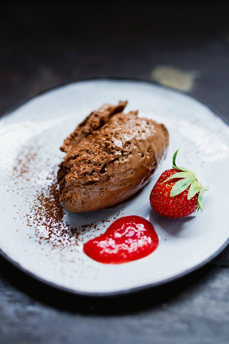 Chocolate mousse with strawberry sauce
