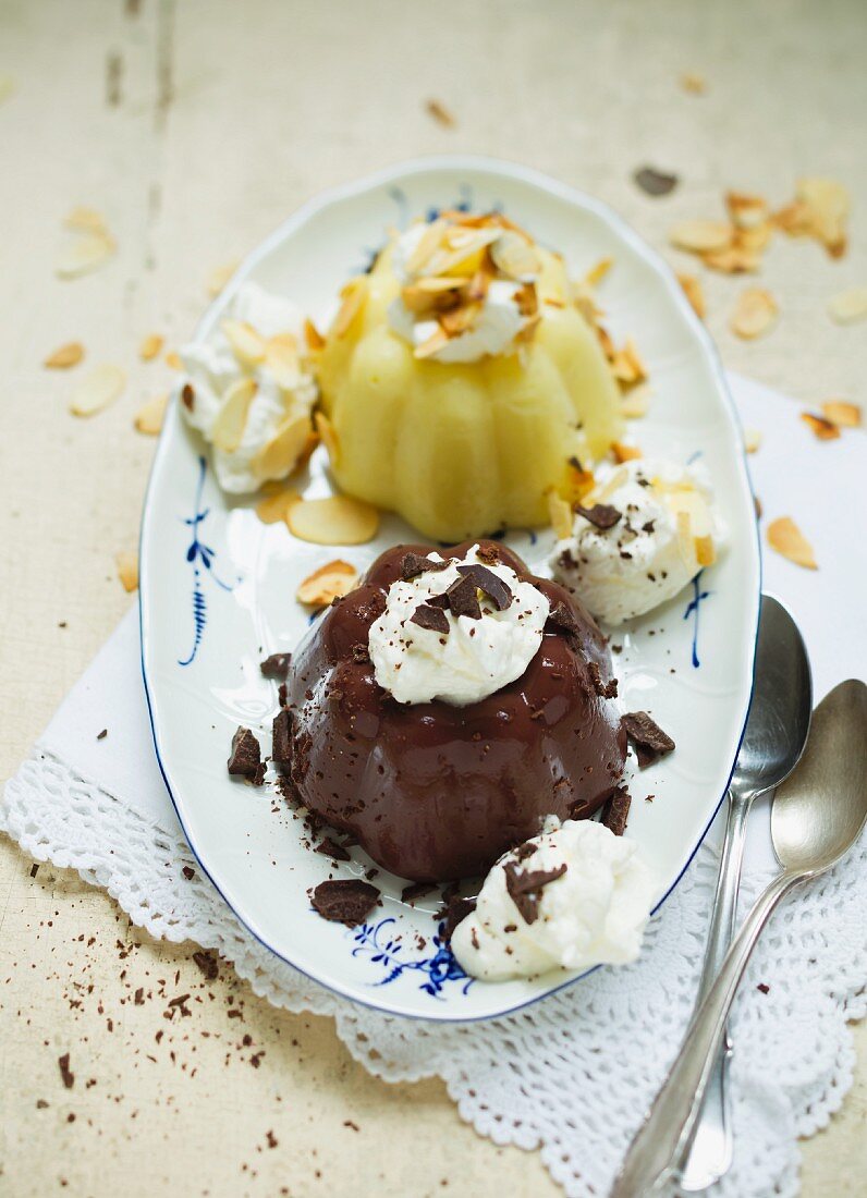 Vanilla and chocolate pudding with cream and slivered almonds