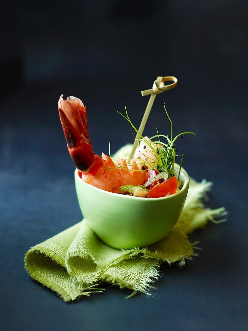A bowl of prawns with vegetables and chives